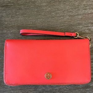 Coral pink Tory Burch Zip around wrist wallet